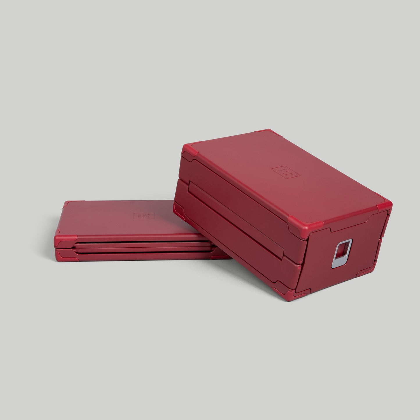 SUNSAL collapsible yoga block in Burgundy, shown expanded and collapsed, on a light grey background