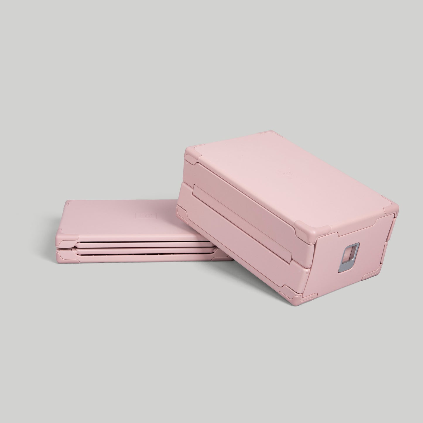 SUNSAL collapsible yoga block in Rosewood pink, shown expanded and collapsed, on a light grey background