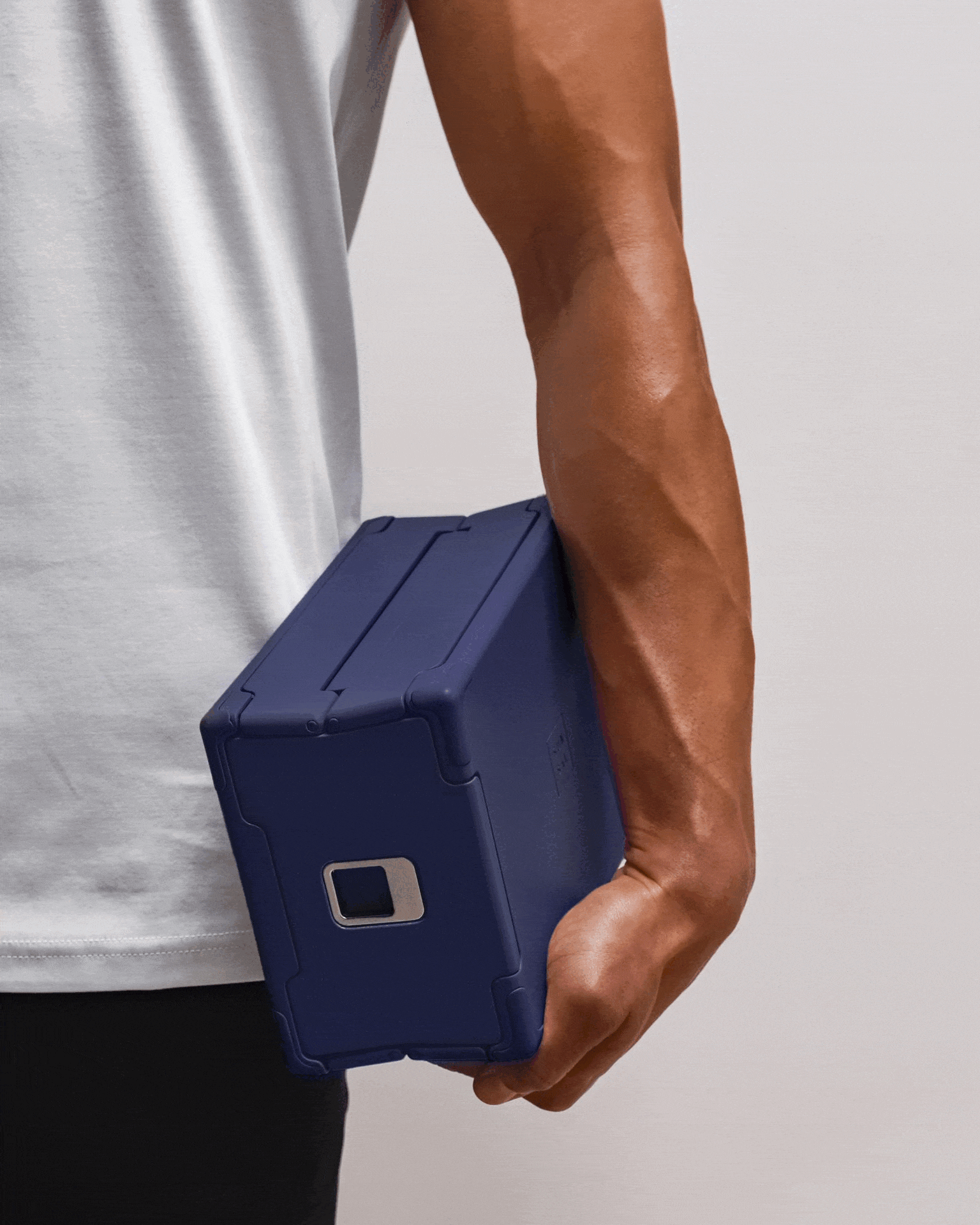 GIF of a SUNSAL yoga block in Navy transitioning between expanded and collapsed states, showcasing portability and thoughtful design