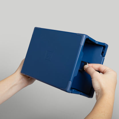 Navy Sunsal yoga block mid-close, showcasing its innovative collapsible design