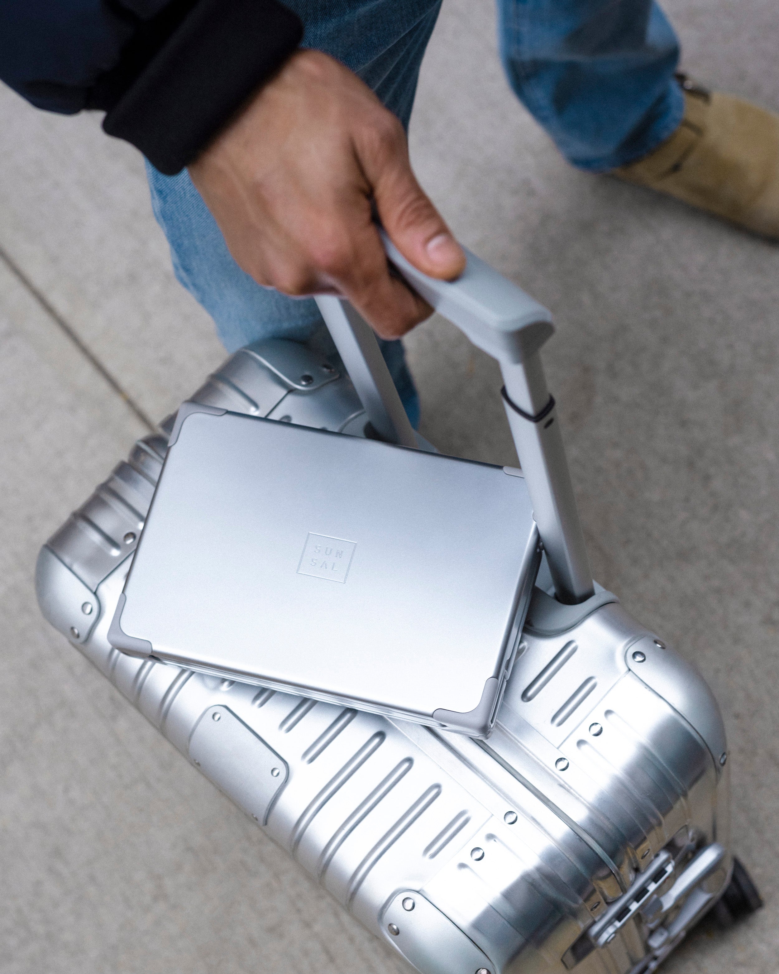 SUNSAL collapsible yoga block on top of a travel suitcase, ideal for on-the-go lifestyles
